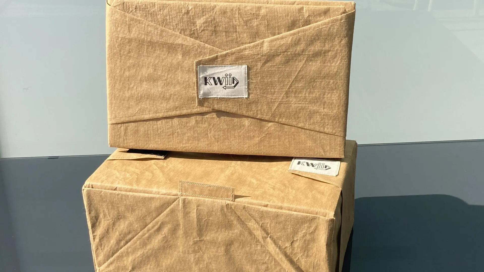 Two reusable boxes showcasing sustainable and eco-friendly packaging solutions.