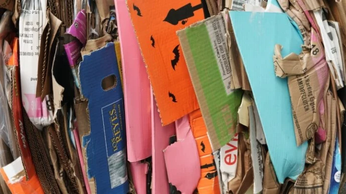 Cardboard waste highlighting the need for sustainable packaging solutions, waste reduction, and eco-friendly materials.